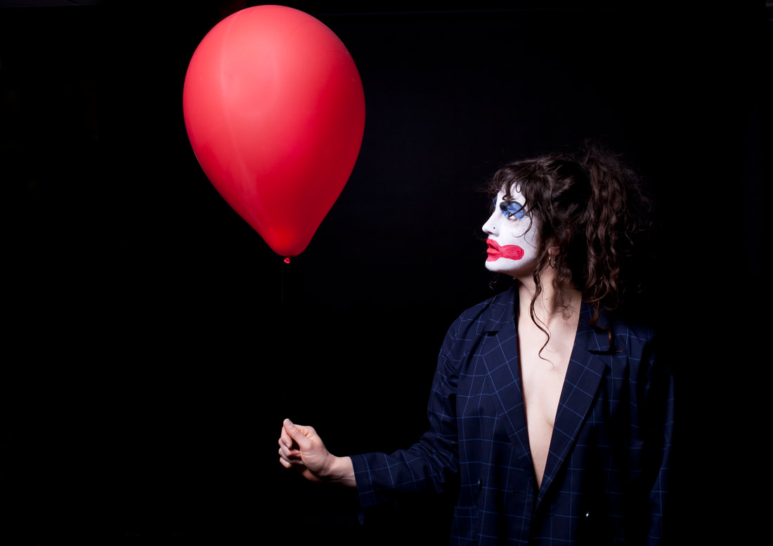Laura Murphy Holding Red Balloon - A Spectacle Of Herself